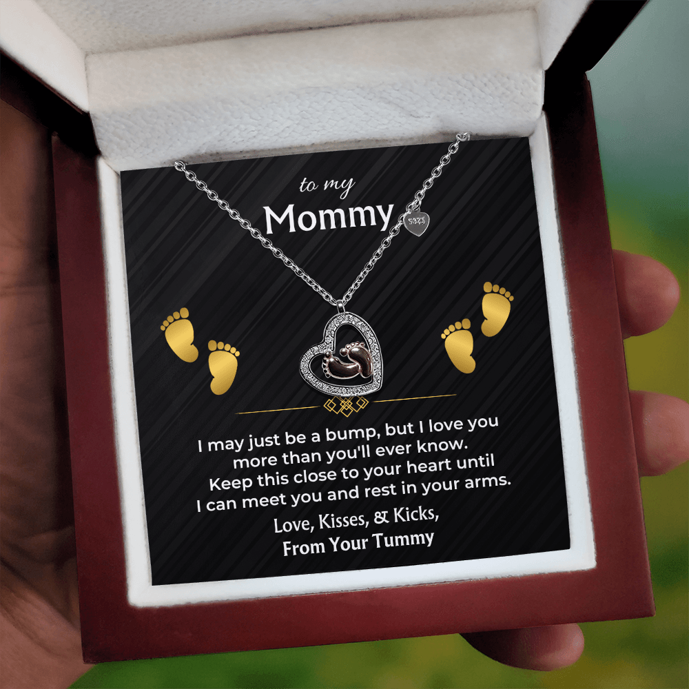 Sterling silver baby feet necklace for an expecting mom with keepsake message card
